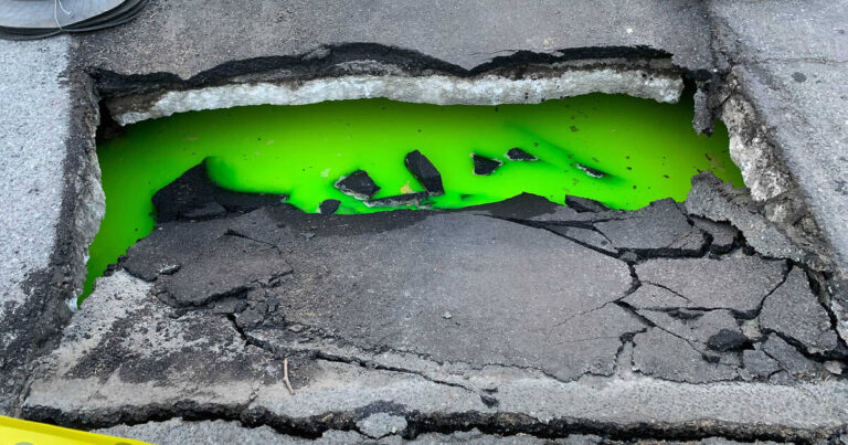 This Neon Green-Glowing Toronto Sinkhole is Terrifying